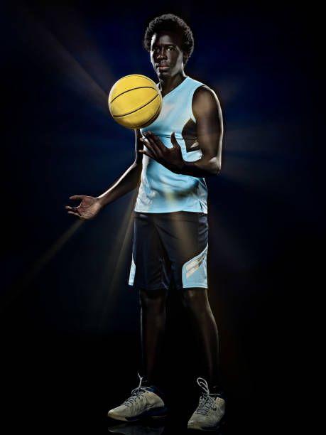 istock young african basketball player man isolated black background 1281528210
