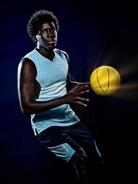 istock young african basketball player man isolated black background 1281528213