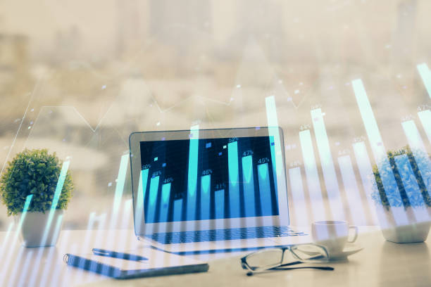 istock Forex Chart hologram on table with computer background. Double exposure. Concept of financial markets. 1281529119