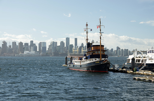 New York City Sky line  from Staton Island with a yellow ferry going towards the city