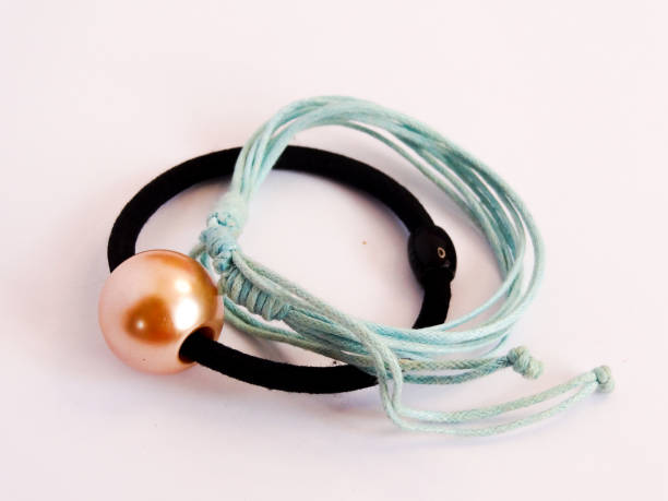 istock bracelet in white pearl and blue on white background 1281530942