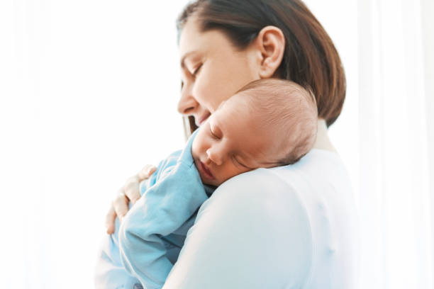 Mother with newborn son stock photo