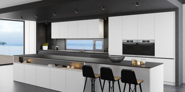 istock Luxurious matte black and white minimalist Italian style kitchen interior with long island table 1281532851