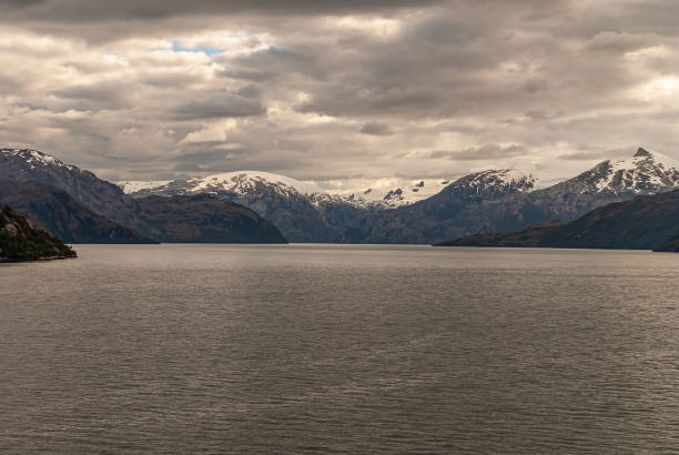 istock Snow on mountain group under cloudscape in Sarmiento Channel, Chile. 1281533717