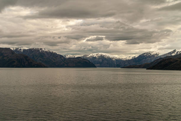 istock Snow on mountain group under cloudscape in Sarmiento Channel, Chile. 1281533718