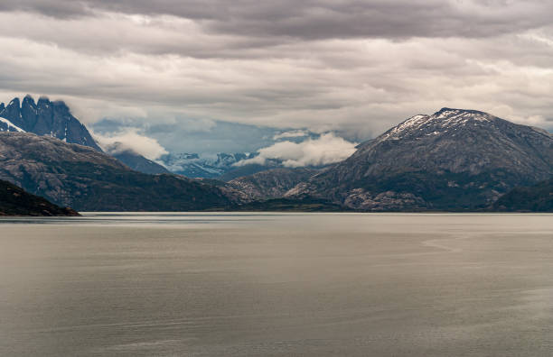 istock Mountain range with peaks under cloudscape in Sarmiento Channel, Chile. 1281533771