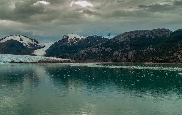 istock Amalia glacier and floating ice pieces in Sarmiento Channel, Chile. 1281533780