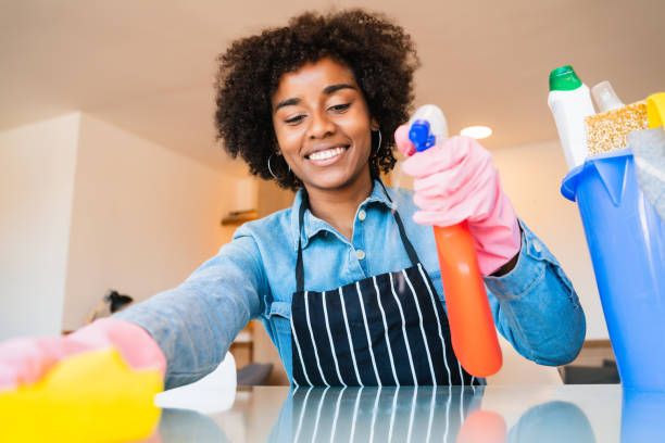 istock Afro woman cleaning new home. 1281534888