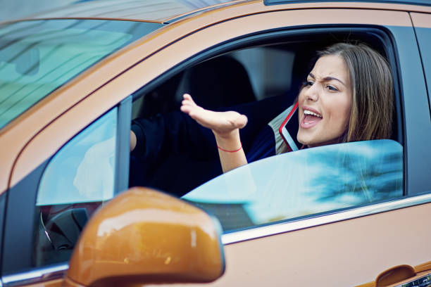 aggressive young woman is shouting in a traffic jam - traffic jam traffic sports utility vehicle car imagens e fotografias de stock