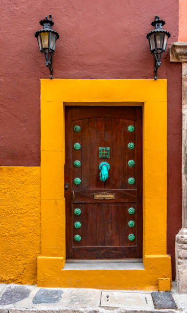 istock door with a green hand knocker 1281536503