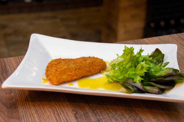 istock Crispy cheese with salad to accompany 1281538201
