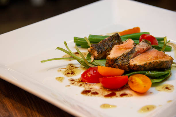 istock Salad Nicoise, prepared with Salmon in Herbs Croute 1281539146