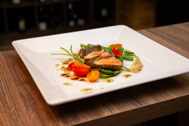 istock Salad Nicoise, prepared with Salmon in Herbs Croute 1281539840