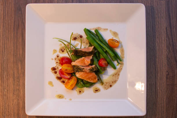 istock Salad Nicoise, prepared with Salmon in Herbs Croute 1281539892