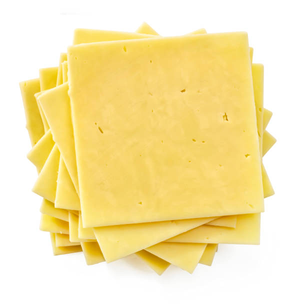 istock Stack of cheese slices, top view, isolated on white.  Natural cheddar. 1281539954