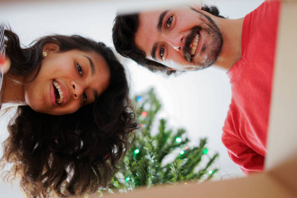 istock christmas young couple celebrating 1281540053