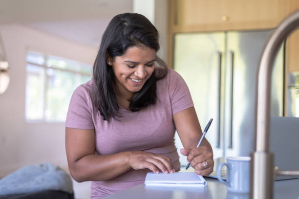 istock Ethnic Pregnant Woman Working From Home 1281543152