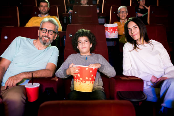 istock Couple enjoying with son at the cinema 1281543280