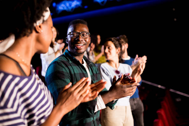 istock Spectators applauding after a film projection 1281543301