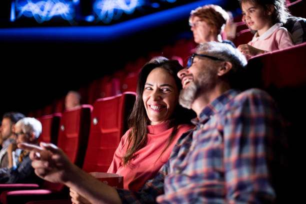 istock Mature couple having fun at the cinema 1281543320