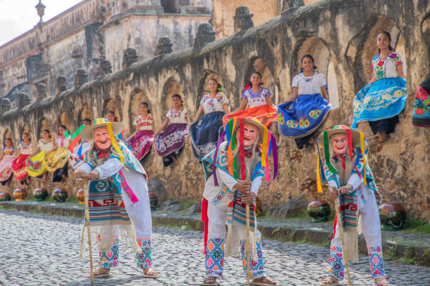 Patzcuaro, Michoacan, Mexico- October 3, 2020: Mexican folklore group pose in the city of Patzcuaro, considered a magical town. The dance of the old people is called this type of dance very characteristic of the region. Michoacan is considered one of the most touristic states for its traditions.