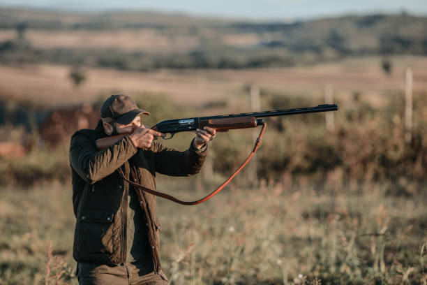 istock A hunter with a gun. Autumn hunting. Huntsman. 1281552742