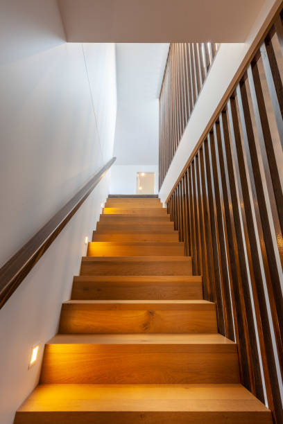 istock Wooden staircase looking up. Modern home interior. 1281554819