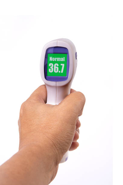 istock Hand holding handheld infrared thermometer that showing body temperature. 1281556521