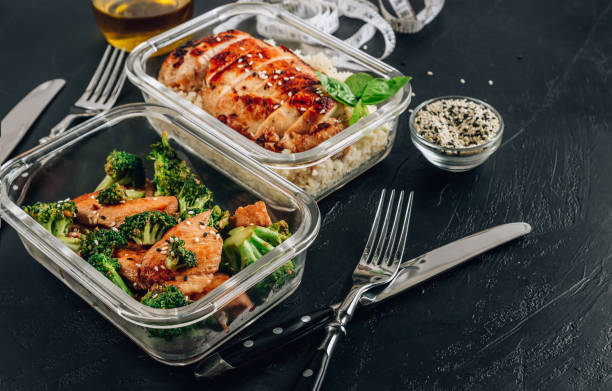 istock Keto lunchboxes - grilled chicken with cauliflower rice and chicken and broccoli 1281557347