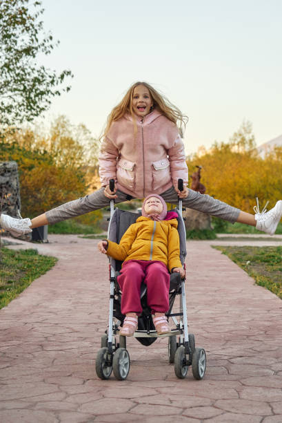 istock Sisters on a walk in the park 1281561063