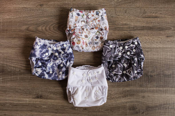 istock Blue & White Reusable Cloth Diapers on a Wooden Floor 1281562703