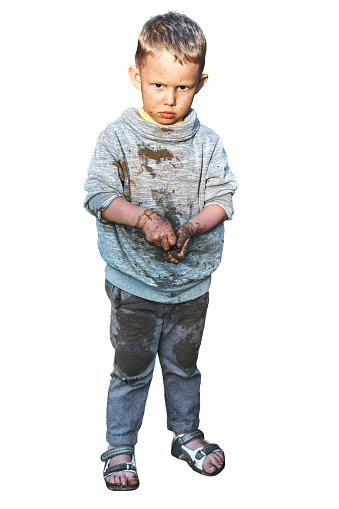Angry dirty boy after playing in the sandbox, isolated on white background