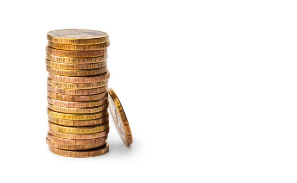 istock Yellow metal coins on a white background 1281572901