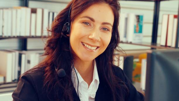 istock Business people wearing headset working in office 1281573184