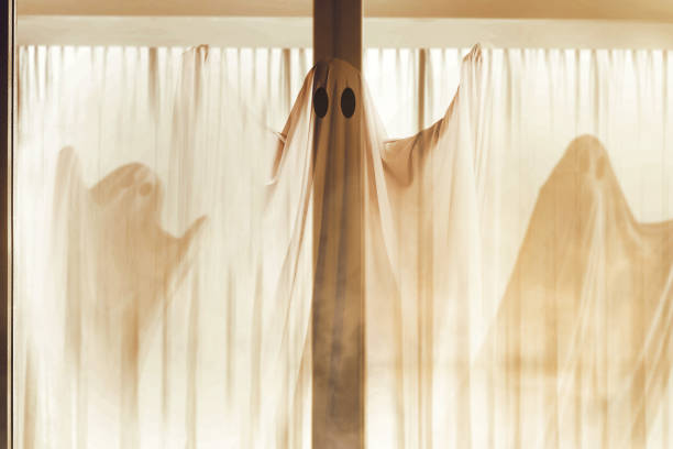 istock White ghost haunting the abandoned house 1281573222