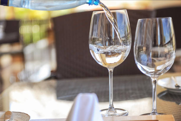 istock Pouring water in glass 1281573241