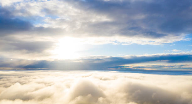 istock Aerial view white clouds in blue sky. View from drone. Aerial view cloudscape texture background. Texture of clouds. View from above. Panorama clouds background 1281574295
