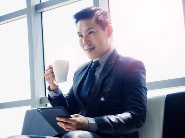 istock Asian businessman in suit wearing protective face mask. 1281577222