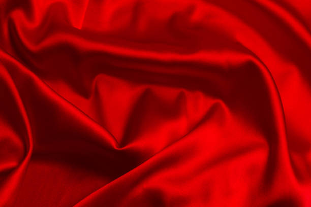 istock Red silk or satin luxury fabric texture can use as abstract background. 1281580609