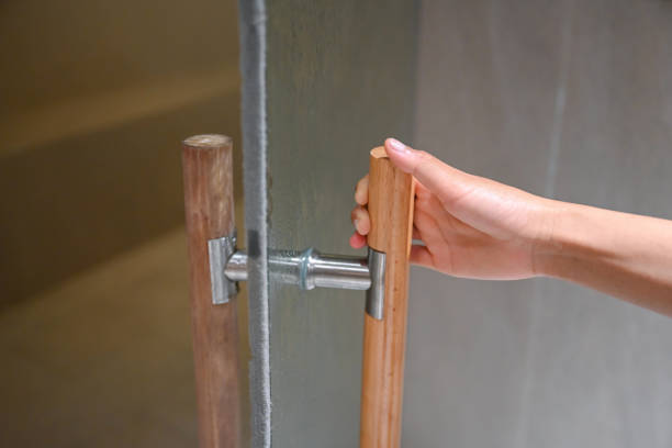 istock Woman opening a glass door 1281581484
