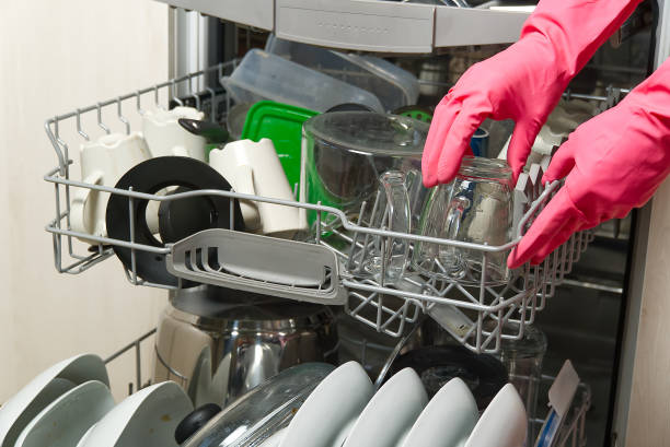 istock Dirty dish in open integrated dishwasher. Open dishwasher with dirty dishes inside before washing. full loaded dishwasher ready for washing. 1281581932