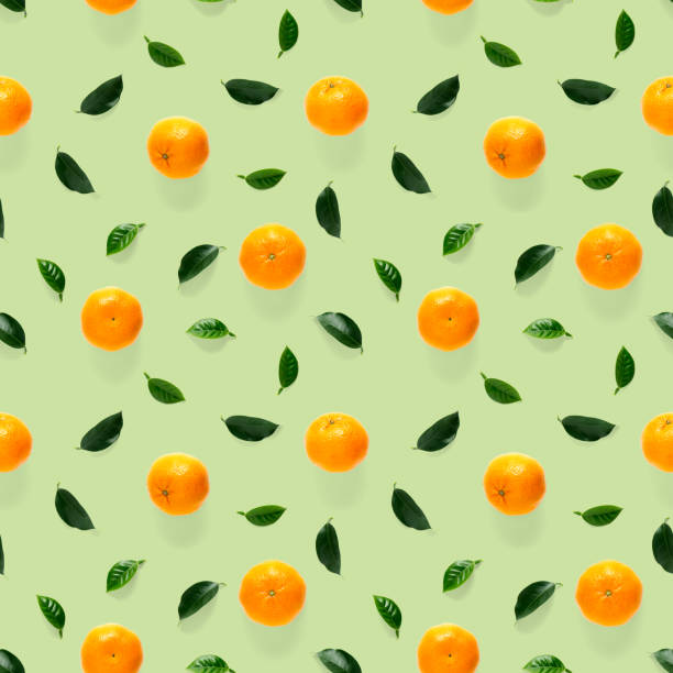 istock Mandarine seamless pattern, tangerine, clementine isolated on green background with green leaves. Collection of fine seamless patterns. 1281583089
