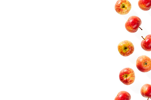 green apple, strawberry and raspberries and leaves isolated on a white background.