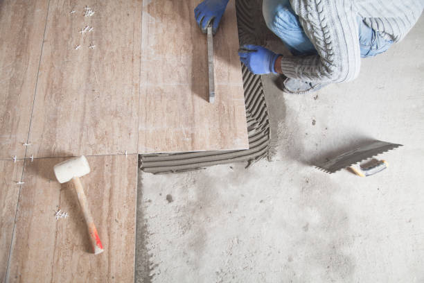 istock Laying floor ceramic tile. Renovating the floor 1281586282
