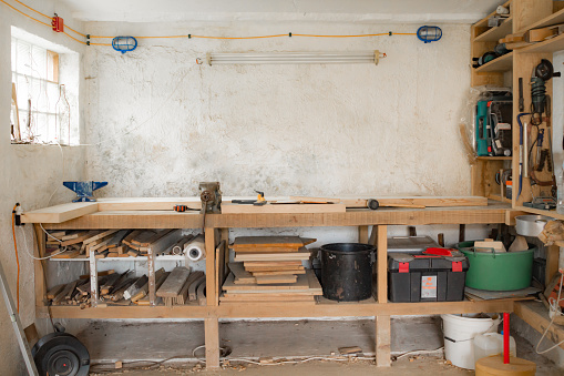 Various carpenter's tools and supplies in a garage.