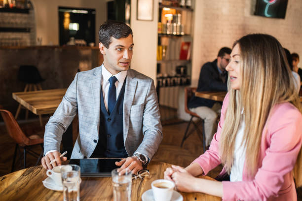 istock Modern ambitious young woman presenting herself during job interview at the coffee shop 1281587792