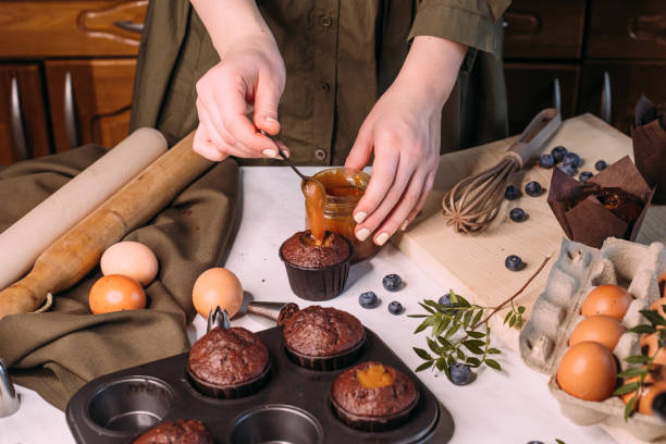 istock process making homemade chocolate cupcake with cream 1281588180