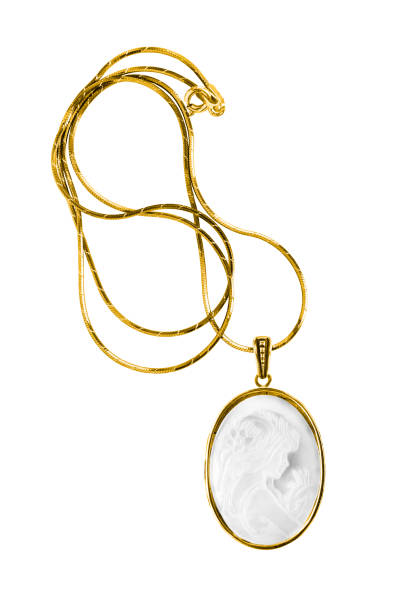 Cameo necklace isolated Gold necklace with a vintage cameo locket isolated over white photo necklace stock pictures, royalty-free photos & images