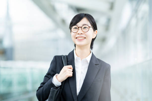 istock A young woman smiling in a suit 1281591212