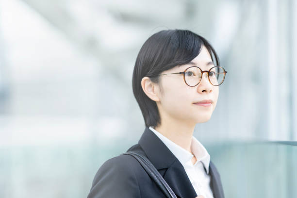 istock A young woman smiling in a suit 1281591254